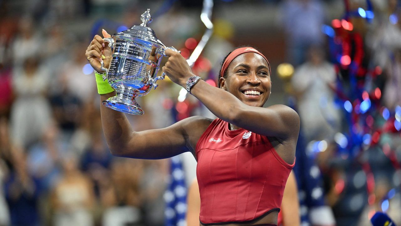 Coco Gauff poses with the 2023 US Open trophy